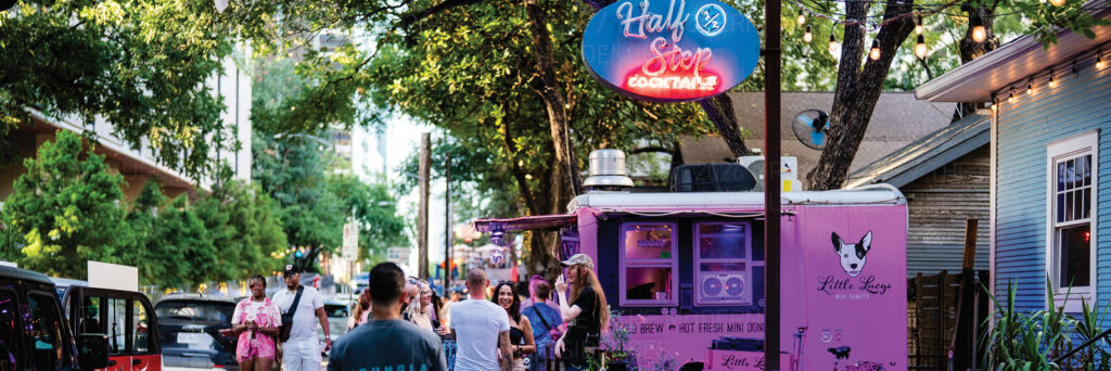 People on Rainey Street outside Half Step near The Modern Austin Residences