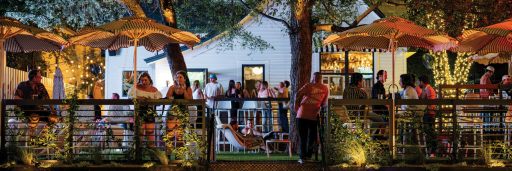 People enjoying the patio at Victory Lap on Rainey Street near The Modern Austin Residences