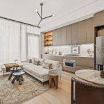 Modern condo living room with sofa and small dining table