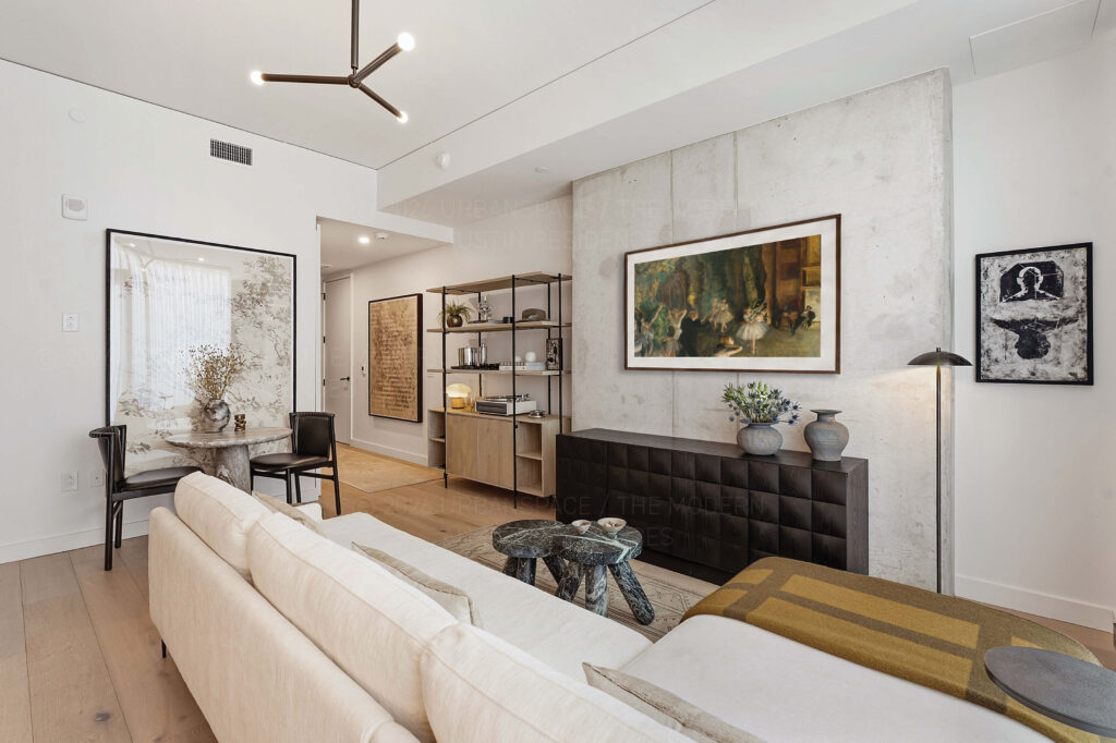 Modern condo living room with sofa and wall hung TV