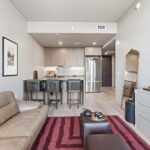 Modern condo living room furniture and kitchen
