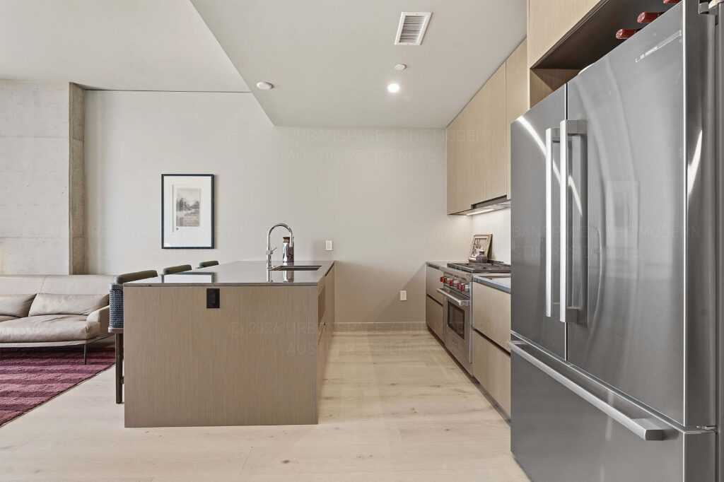 Modern condo kitchen island and refrigerator