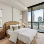 Modern condo bedroom with balcony view